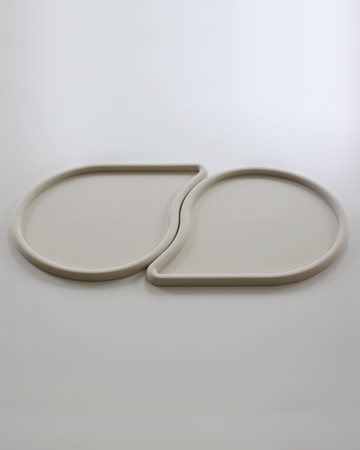 two raindrop shaped pet feeding mats by catenary home modern cat furniture company that can be used as a cat food mat and dog food mat or pet meal mat that fit into each other 