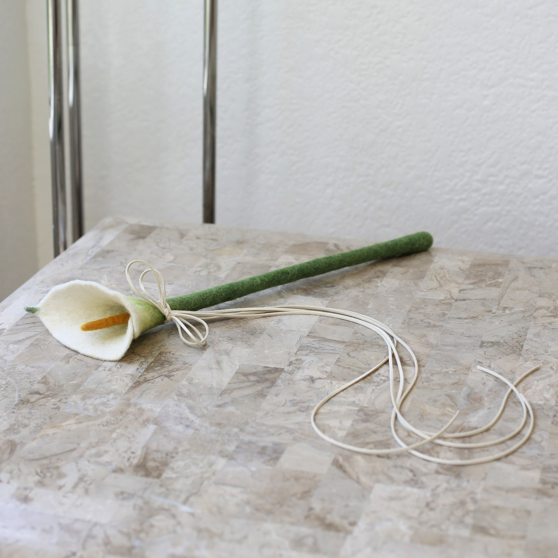 calla lily toy wand called flora by modern cat furniture company catenary on tessellated stone table 