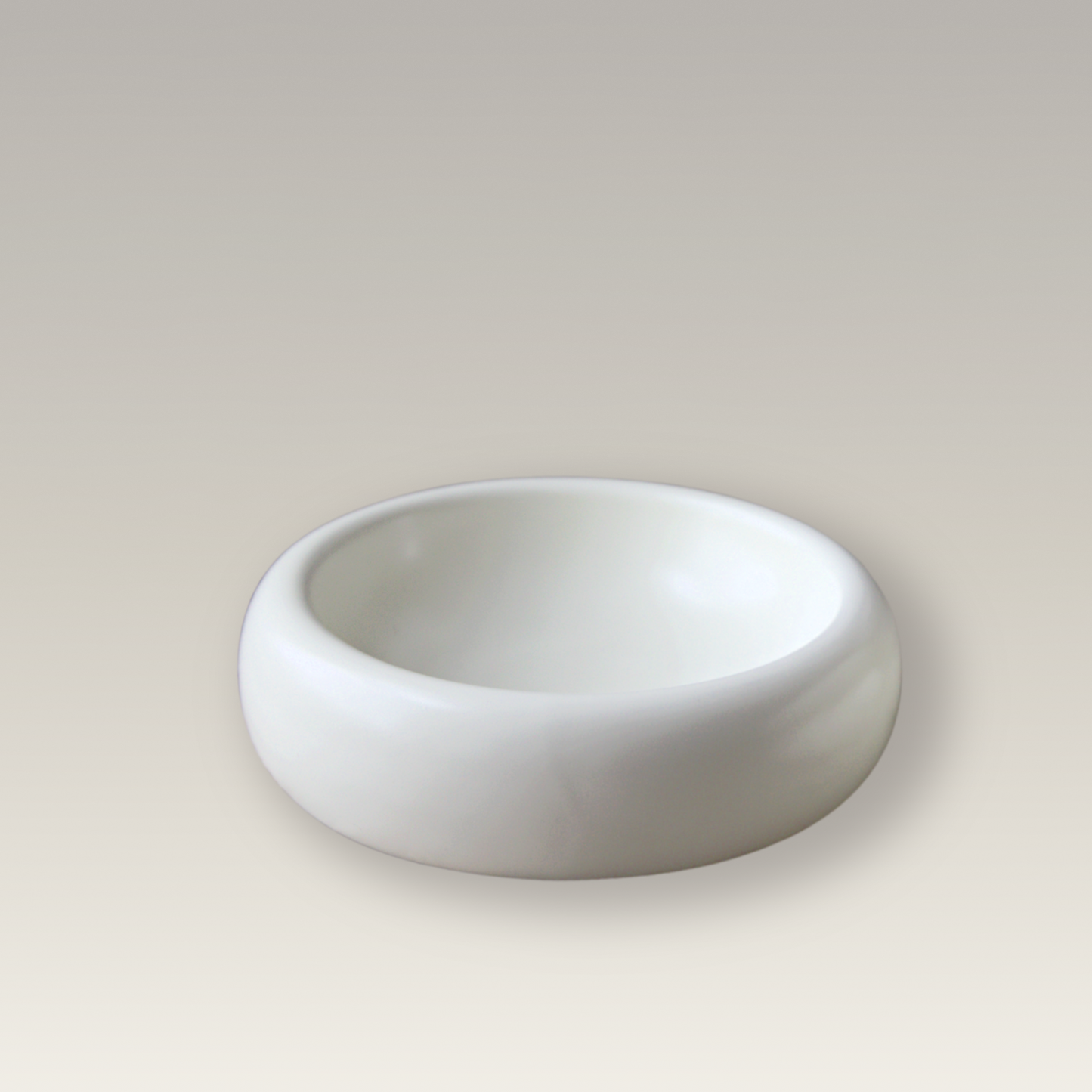 product image of modern cat food bowl on beige background with wide and shallow design to prevent whisker fatigue