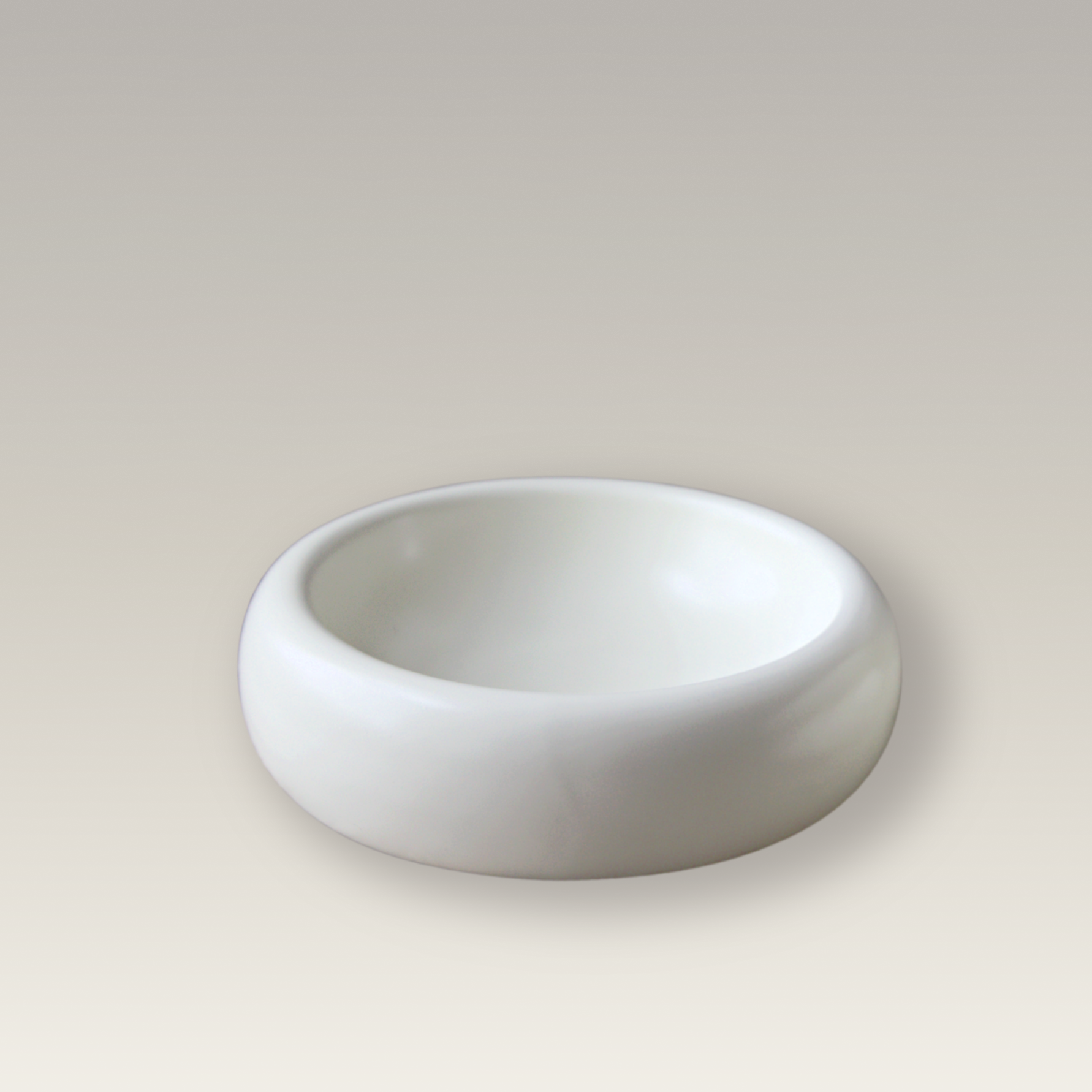 product image of modern cat food bowl on beige background with wide and shallow design to prevent whisker fatigue