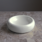 catenary white ceramic cat bowl on beige marble table